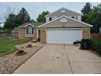 Charming two-story home with a two car garage, brick accents and a well maintained yard at 5171 S Quintero St, Centennial, CO 80015