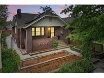 Charming brick home with a well-maintained front yard and garden, perfect for curb appeal at 3611 N Vine St, Denver, CO 80205