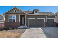 Charming two-story home featuring a three-car garage, brick accents, and well-maintained landscaping at 2906 E 163Rd Ave, Thornton, CO 80602