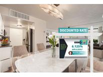 Bright dining area with a modern table, seating, and an open layout to the kitchen and living area at 1250 N Humboldt St # 201, Denver, CO 80218