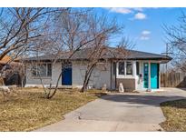 Charming single-story home with a blue door and neatly landscaped front yard, perfect for curb appeal at 1270 S Lowell Blvd, Denver, CO 80219