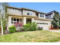 Charming two-story home with manicured lawn and lovely landscaping at 11670 S Flower Mound Way, Parker, CO 80134