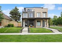 Contemporary home featuring a rooftop deck and well-manicured lawn at 2391 King St, Denver, CO 80211