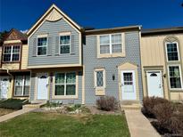 Charming townhome featuring a well-maintained lawn and cozy front entrances with great curb appeal at 1732 S Blackhawk Way # D, Aurora, CO 80012