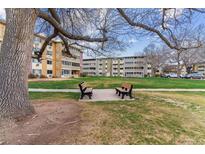 Well-maintained community grounds with inviting benches at 9385 E Center Ave # 6A, Denver, CO 80247