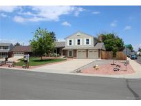 Charming two-story home featuring a well-manicured lawn, brick accents and an attached two-car garage at 3785 E 134Th Ct, Thornton, CO 80241