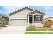 Charming single-story home featuring a two-car garage and a well-maintained front yard at 481 Vista Blvd, Brighton, CO 80603
