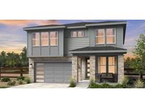 Two-story house with gray siding, stone accents, and a two-car garage at 7255 Prairie Sage Pl, Littleton, CO 80125