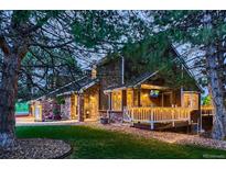 Charming exterior view of home with inviting front porch and mature landscaping at 9658 Coronado Ct, Parker, CO 80134