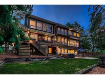 Spacious two-story home featuring a deck, a hot tub, and large windows that provide ample natural light at 9658 Coronado Ct, Parker, CO 80134