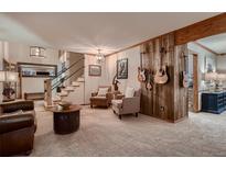 Inviting living room with wood accents, comfortable seating, and stylish decor create a warm atmosphere at 9658 Coronado Ct, Parker, CO 80134