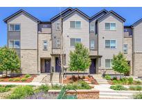 Attractive townhome exterior with landscaping, hardiplank, and stone detailing at 5387 Pierson Ct, Wheat Ridge, CO 80033