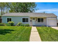 Charming single-story home features a well-manicured lawn and inviting entryway at 2751 S Elm St, Denver, CO 80222