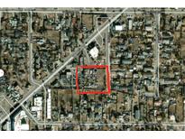 Aerial view of a neighborhood featuring the property at 959 S Wolff St, outlined in red, nestled among residential streets at 971 S Wolff St, Denver, CO 80219