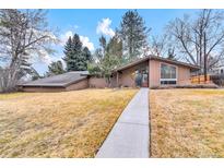 Charming single-story home with a well-manicured front yard and inviting walkway at 2978 Robb Cir, Lakewood, CO 80215