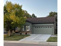 Charming home featuring an attached garage and a well-maintained lawn at 4868 Collingswood Dr, Highlands Ranch, CO 80130