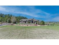 Stunning home boasts professional landscaping and rock design on a beautiful lot at 19336 Queens Crescent Way, Monument, CO 80132