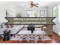 Elegant living room featuring modern furniture, hardwood floors and a ceiling fan at 2895 S Sherman St, Englewood, CO 80113