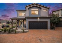 Charming two-story home with a paved driveway and well-manicured landscaping at 17996 E 54Th Ave, Denver, CO 80249