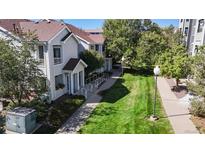 Charming exterior view showcasing well-maintained landscaping and inviting walkway to building entrance at 5320 Allison St # 202, Arvada, CO 80002