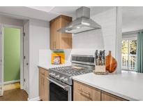 Modern kitchen with stainless steel appliances and ample counter space at 5374 W Canyon Trl # B, Littleton, CO 80128