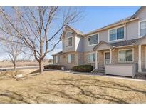 Charming two-story townhouse featuring a brick facade and well-maintained front yard at 1283 W 112Th Ave # B, Denver, CO 80234