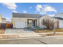 Charming one story home with a one car garage and covered porch, located in a suburban neighborhood at 15614 E 51St Pl, Denver, CO 80239