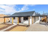 Charming one-story home featuring a covered porch, landscaped front yard, and modern architectural details at 3230 Newport St, Denver, CO 80207