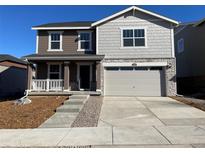 Beautiful two-story home with a two car garage and manicured lawn at 21965 E 39Th Ave, Aurora, CO 80019