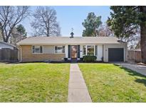 Charming single-story home featuring a well-maintained lawn and inviting curb appeal at 5698 E Greenwood Pl, Denver, CO 80222
