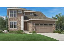 Beautiful two-story home featuring stone accents, a two-car garage, and manicured front yard at 3027 Newfound Lake Rd, Berthoud, CO 80513