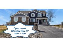 Inviting two-story home with a well-manicured lawn and a welcoming front porch. Open House Saturday May 31st 12pm - 2pm at 5285 La Quinta Cir, Elizabeth, CO 80107