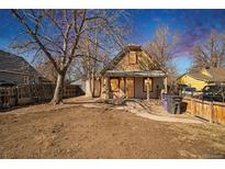 Charming single-story home with a quaint front yard and a welcoming entrance. It has a cozy curb appeal at 133 S Meade St, Denver, CO 80219