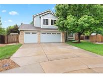 Charming two-story home with a three-car garage and a spacious driveway at 9756 Quay Loop, Broomfield, CO 80021