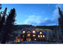 Beautiful log home featuring a serene and peaceful environment among nature at 733 Rainbow Rd, Idaho Springs, CO 80452
