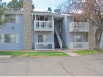 Charming condo with stone chimney, dual balconies, and well-maintained landscaping at 13494 E Jewell Ave # 201, Aurora, CO 80012