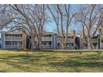 Attractive exterior of a two-story building with landscaping at 8335 Fairmount Dr # 3-201, Denver, CO 80247