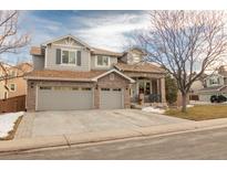 Charming two-story home with a three-car garage and neutral paint at 9807 Arthur Ln, Highlands Ranch, CO 80130