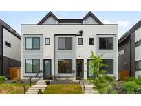 Modern townhome featuring a sleek exterior design, well-maintained landscaping, and inviting entryway at 2179 S Bannock St, Denver, CO 80223