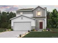 Charming two-story home with a manicured front yard and a two-car garage at 2153 Flower Blossom Ave, Brighton, CO 80601