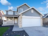 Charming two-story home with a brick and gray siding exterior, front porch, and two-car garage, located at 344 at 344 W 116Th Ave, Northglenn, CO 80234