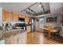 Bright kitchen with granite countertops and stainless steel appliances at 2181 S Victor St # D, Aurora, CO 80014