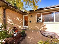 Charming brick home featuring well-kept landscaping, sunny entryway and visible house number at 3240 Folsom St, Boulder, CO 80304