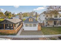Charming home featuring a modern exterior with a cozy front yard and fresh, white paint at 2461 Depew St, Edgewater, CO 80214