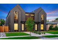 Modern two-story homes feature striking dark wood siding, professional landscaping, and inviting front entrances at 2478 S Cherokee St, Denver, CO 80223