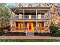 Charming two-story home featuring a covered front porch and balcony at 2843 Havana St, Denver, CO 80238