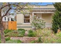 Charming bungalow with a well-maintained front yard and inviting facade at 2339 Lowell Blvd, Denver, CO 80211