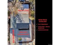 An aerial view showcases a home with RV parking and a spacious 6000 sqft lot, offering ample outdoor space at 1705 S Yuma St, Denver, CO 80223
