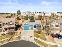Charming two-story home with mature trees, landscaping and an attached three car garage at 23327 E Ottawa Dr, Aurora, CO 80016