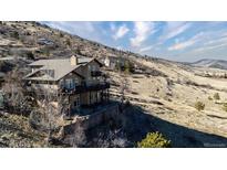 Beautiful home nestled into hillside with multiple decks and stunning views at 11730 Pointe View Dr, Longmont, CO 80503